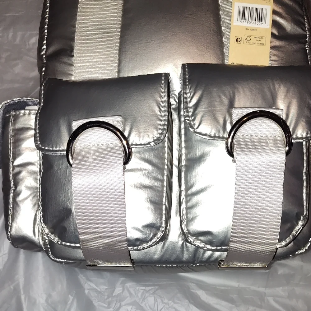 Steve Madden Silver Backpack. Front and side pockets.